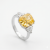 Fancy Vivid Yellow Radiant Cut Diamond Ring with Trillion Side Stones