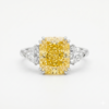 Fancy Vivid Yellow Radiant Cut Diamond Ring with Trillion Side Stones