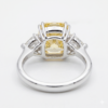 Fancy Vivid Yellow Radiant Cut Diamond Ring with Trillion Side Stones